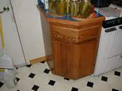 Red oak corner cabinet with a surprise